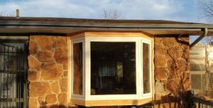 Beautiful bay window with natural light creating perfect reading nook