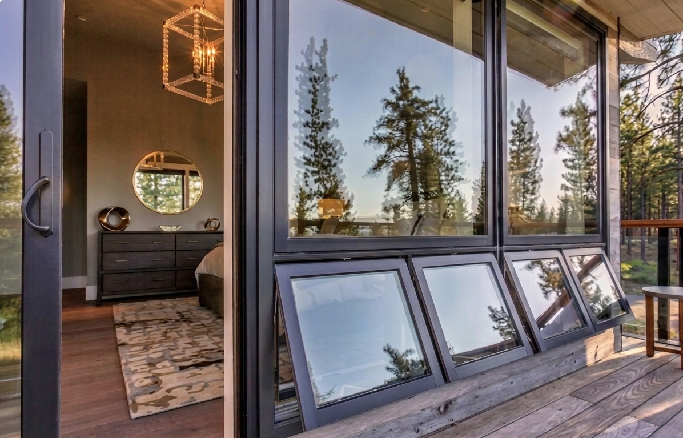 Luxury mountain cabin with Weather Shield large black-frame windows overlooking a deck
