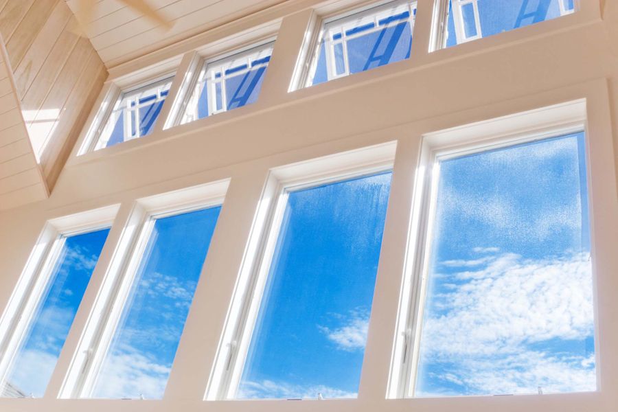 Casement window detail showing beautiful hardware and smooth opening mechanism
