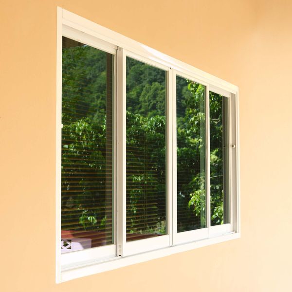 Sliding windows with smooth horizontal sashes and large glass areas