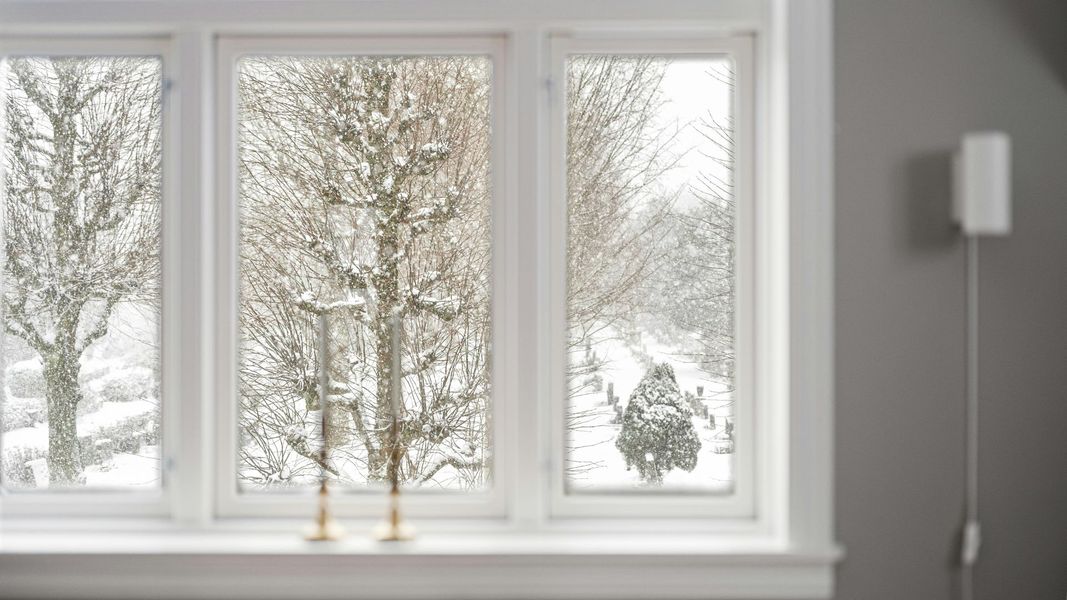 Triple casement windows in white with snowy winter view outside