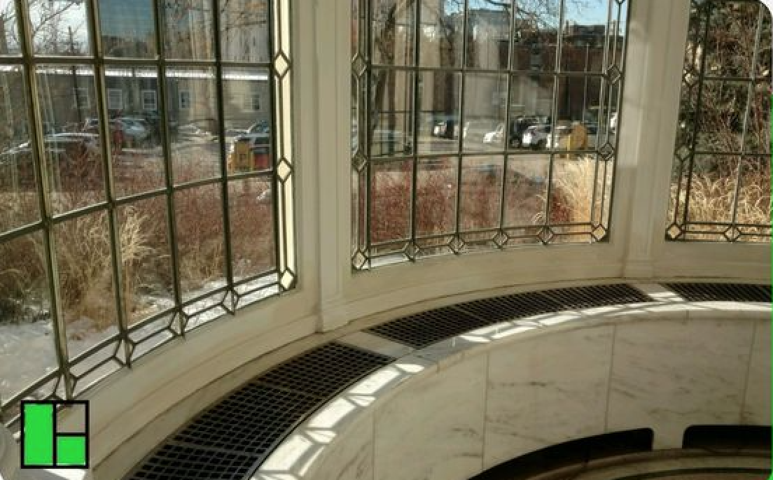 Curved bay of leaded-glass windows in a historic home