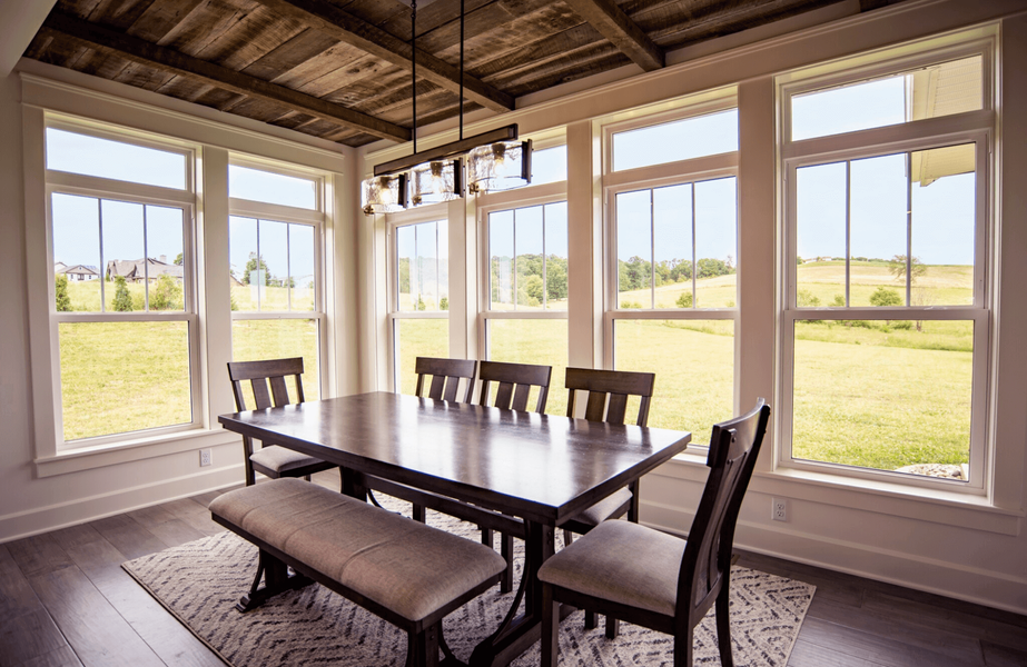 Transom windows installed above main windows adding architectural detail
